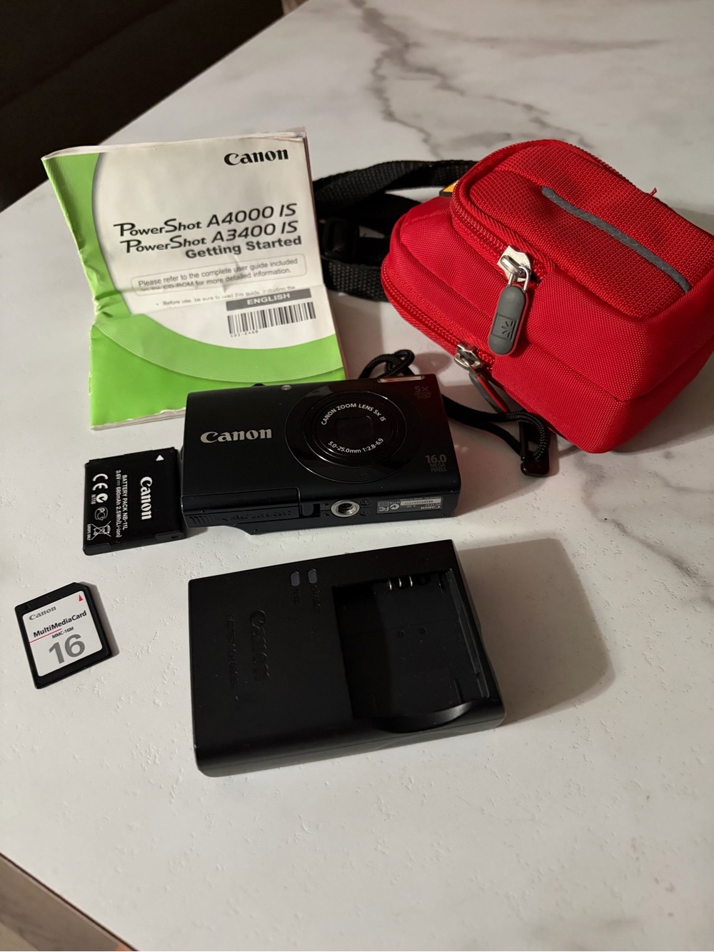 Canon power shot A3400IS Compact Digital Camera in Black with Red Carry Case
